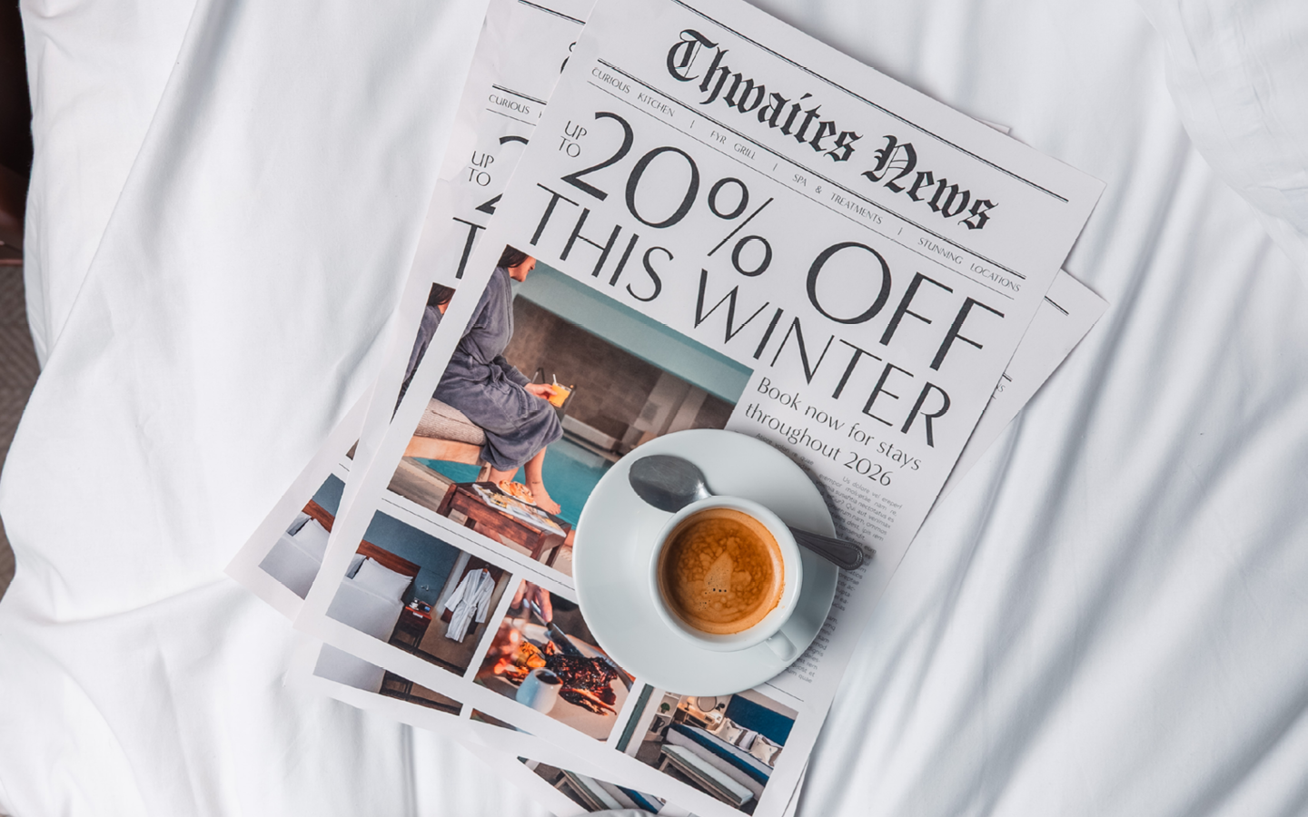 "up to 20% off this winter" newspaper with coffee on hotel bed