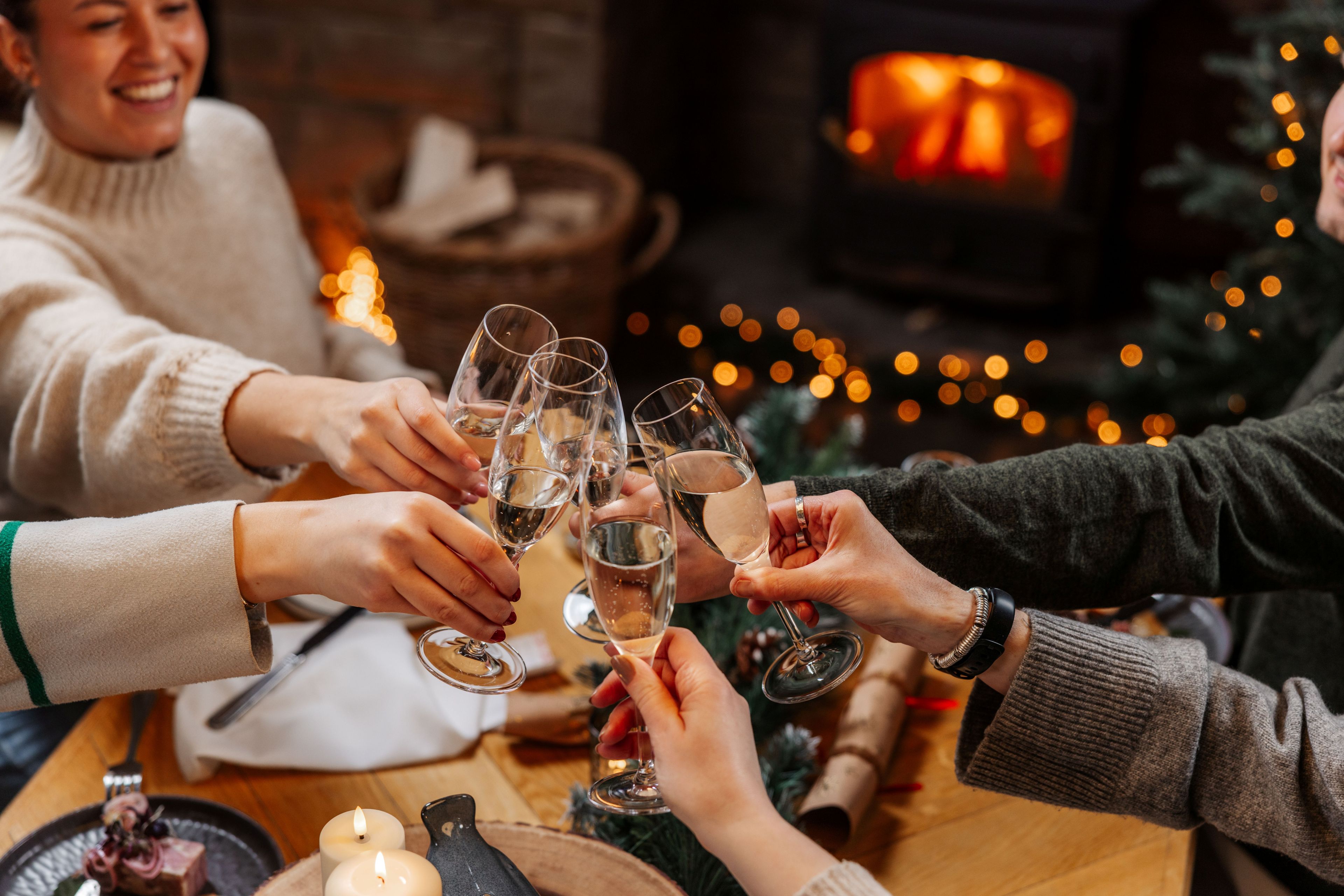 Group of people celebrating with a glass of fizz